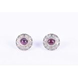 A pair of early to mid 20th century Continental ruby and diamond earringseach centred with a