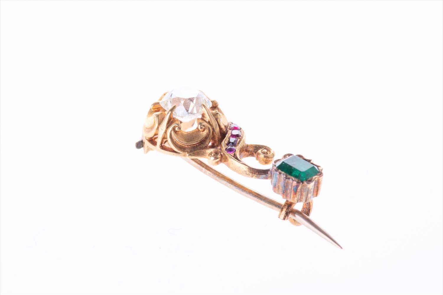 A charming late 19th century yellow gold, diamond, ruby, and emerald broochof swirled bar design, - Image 4 of 7