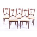 A set of five late Victorian salon chairs with stuff over seats on turned front legs, 87cm high