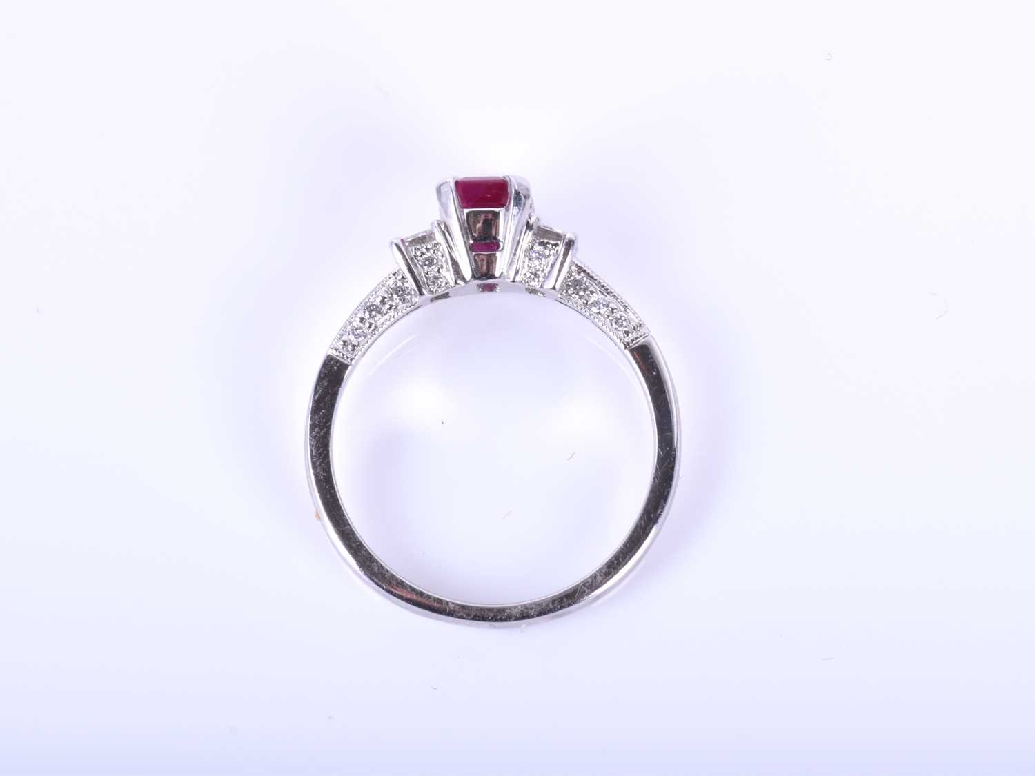 An 18ct white gold, diamond, and ruby ringin the Art Deco style, set with a mixed emerald-cut - Image 2 of 3