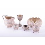A small collection of Indian white metal, 19th century, comprising a serpent handled cream jug,