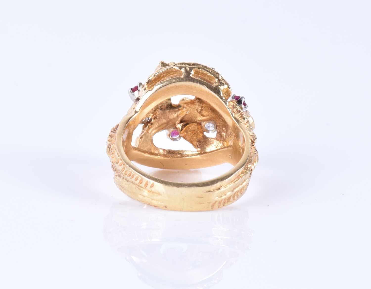 An unusual 1960s 18ct yellow gold, diamond, and ruby ringof Modernist design, the textured mount - Image 5 of 7