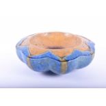 Kate Malone, MBE (Born 1959), a stoneware lobed flower head bowl, the shallow well with pooled glaze