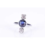 An Art Deco diamond and sapphire ringcentred with a mixed oval-cut sapphire of 2.80 carats, set