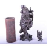 A Chinese carved hardwood figure of Shou Lao, late Qing, carved with a cheerful, smiling face,
