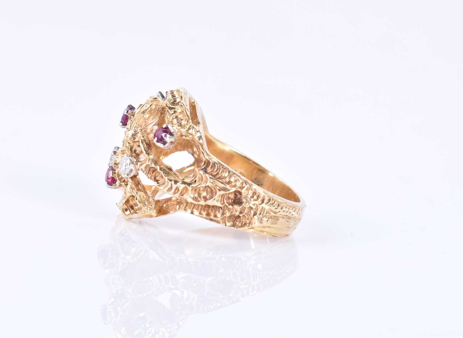 An unusual 1960s 18ct yellow gold, diamond, and ruby ringof Modernist design, the textured mount - Image 2 of 7