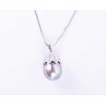 An 18ct white gold, diamond, and pearl pendantset with a silvery-grey South Sea pearl, the tapered