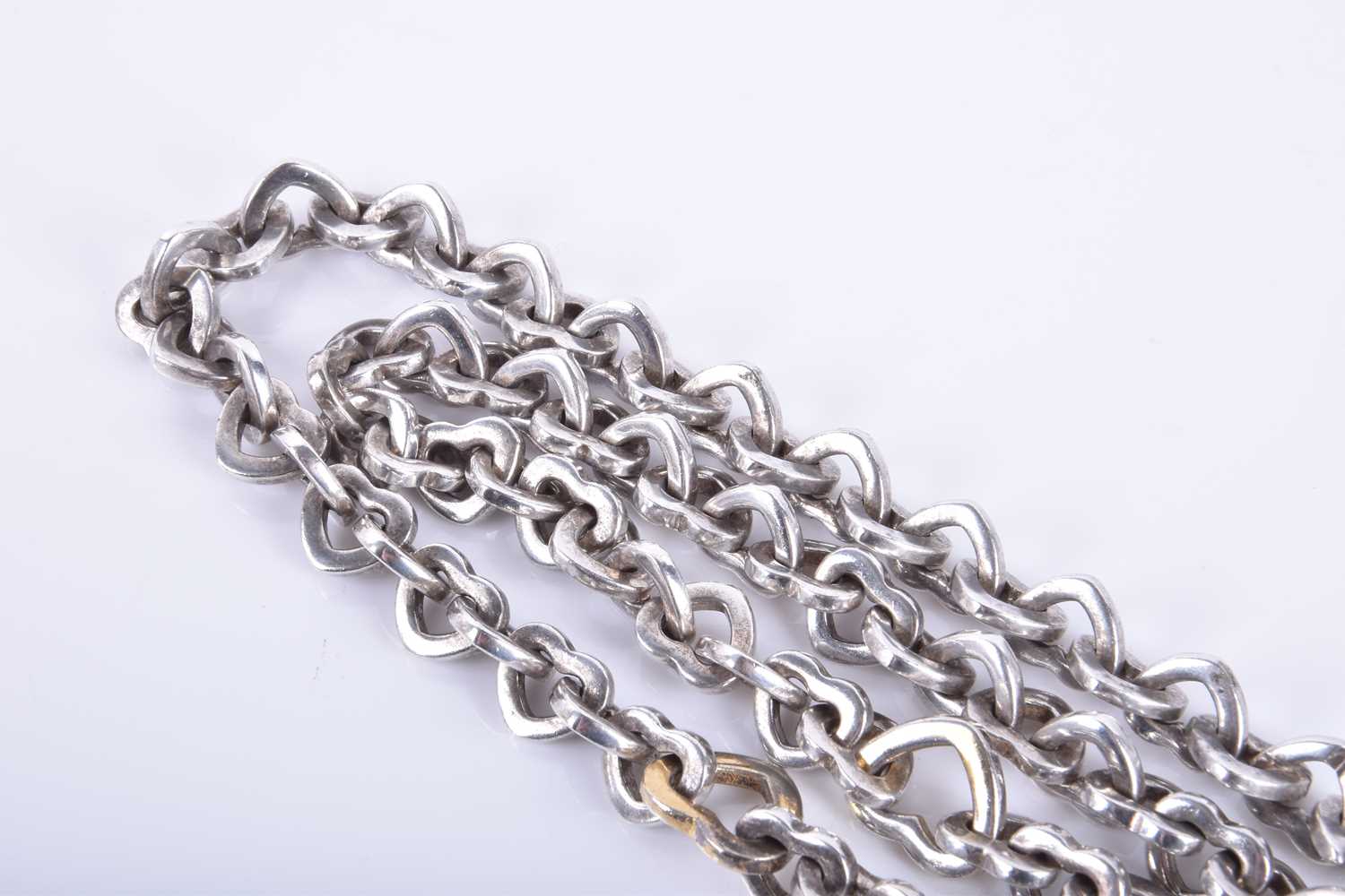 A Tiffany & Co love heart link white metal necklace with two larger gilded links, 43cm long, - Image 2 of 4