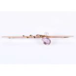 A 15ct yellow gold, pearl, and pink gemstone bar broochof naturalistic design, set with a mixed