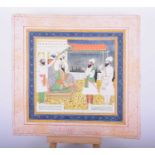Indian School, 19th century, Mughal Emperor receiving two courtiers, within yellow and blue floral