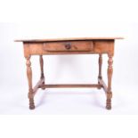 A 19th century fruit wood rectangular kitchen table with single, central drawer, on turned and block