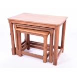 A graduated nest of three Robert Thompson of Kilburn 'Mouseman' occasional tables in light oak, on