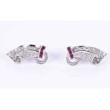 A pair of white gold, diamond, and ruby earringscirca 1950s, the swept mounts each with a row of
