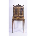 A 19th century Chinese Canton lacquered bonheur-du-jour on table stand the upper twin-cupboard doors