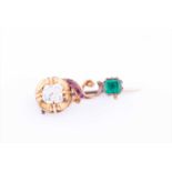 A charming late 19th century yellow gold, diamond, ruby, and emerald broochof swirled bar design,