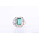 A diamond and emerald ringin the Art Deco taste, centred with an emerald-cut emerald of