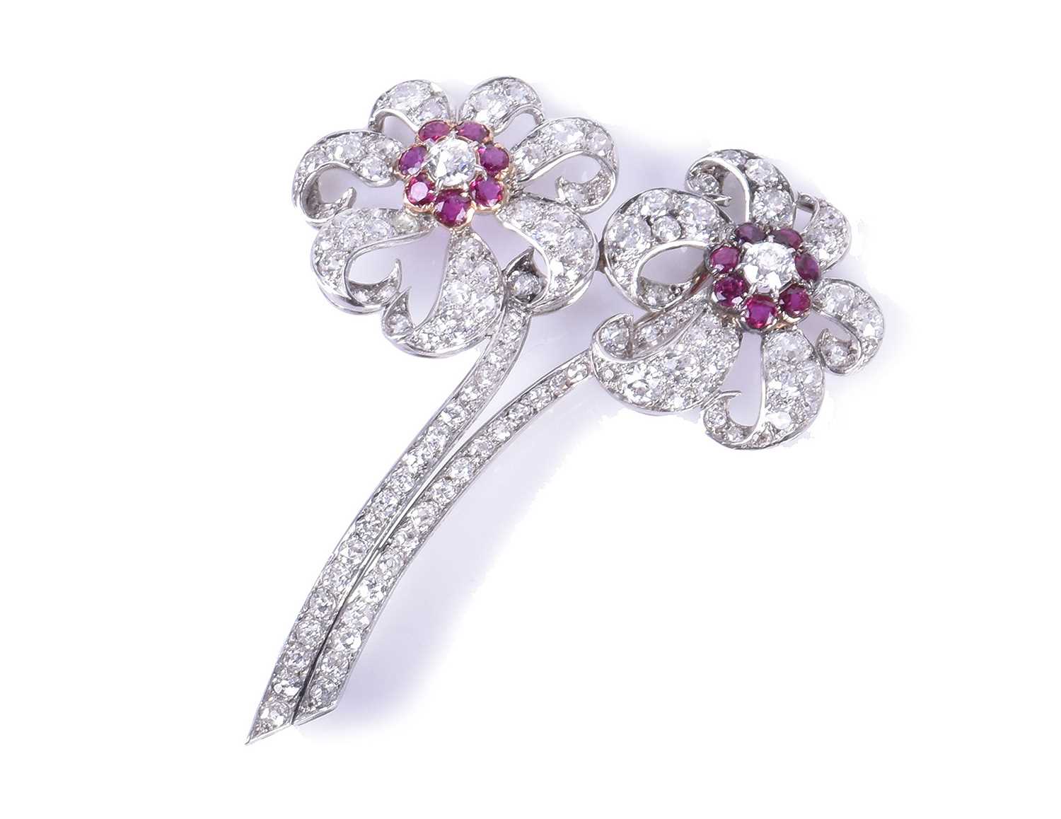 An impressive diamond and ruby floral broochcirca early to mid 20th century, each flower centred