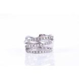 An unusual crossover-style ringset with three rows of round brilliant-cut diamonds over a plain