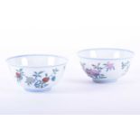 A pair of Chinese doucai bowls, the interior decorated with peaches, the exterior with finger