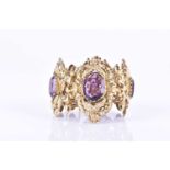 A late Victorian gilt metal and amethyst glass braceletiof ornate design, comprising of five