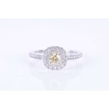 A 14k white gold, and fancy yellow diamond ringset with a round brilliant yellow diamond of