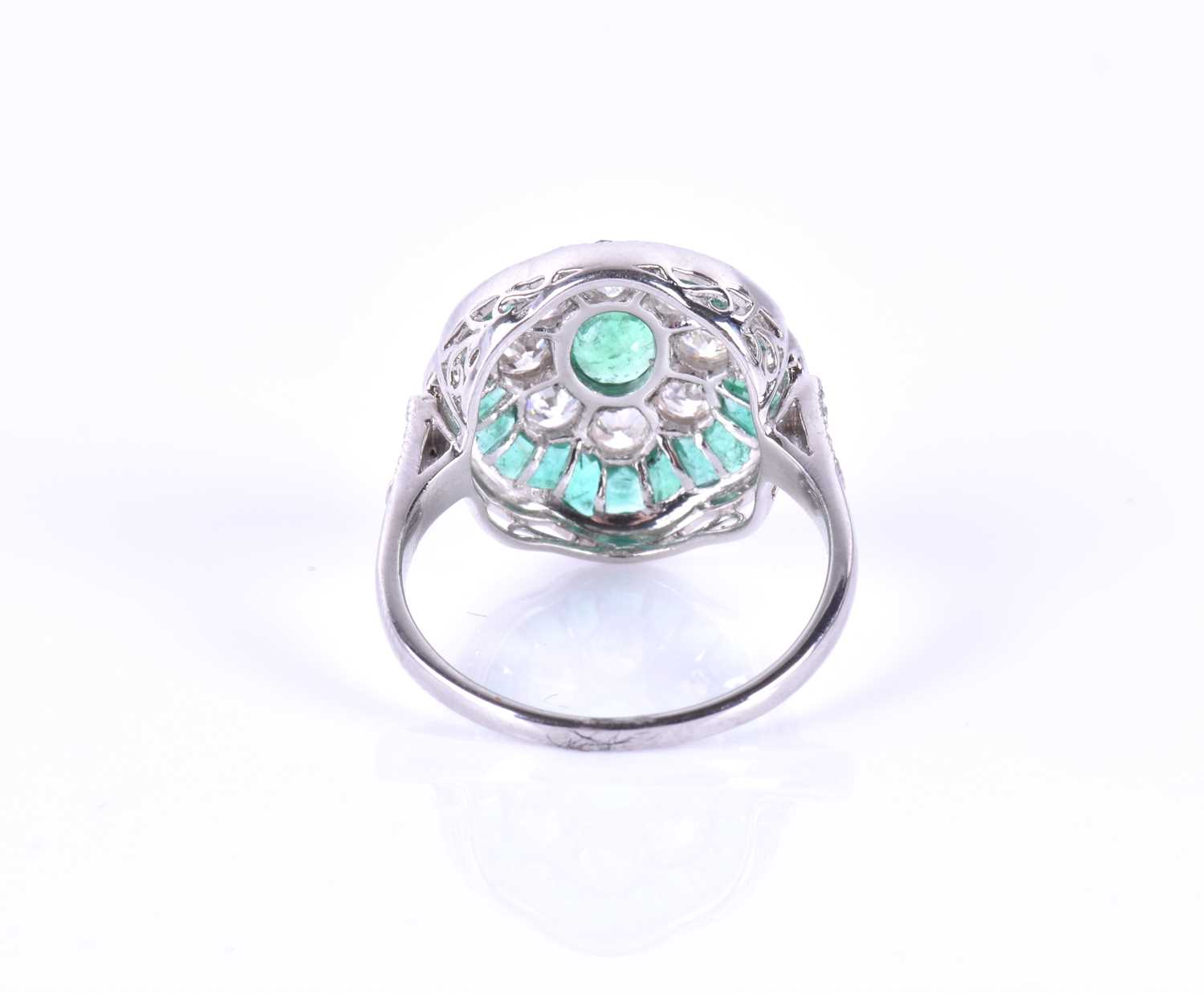 A diamond and emerald cocktail ringcentred with a mixed oval-cut emerald, within a border of round - Image 3 of 5