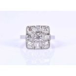 A platinum and diamond ringin the Art Deco style, set with round-brilliant and baguette-cut diamonds