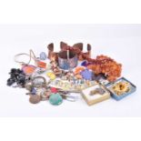 A group of costume jewellery itemsincluding copper bangles, enamel pendants, various bracelets,