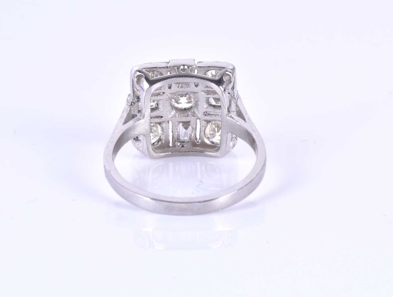 A platinum and diamond ringin the Art Deco style, set with round-brilliant and baguette-cut diamonds - Image 2 of 3