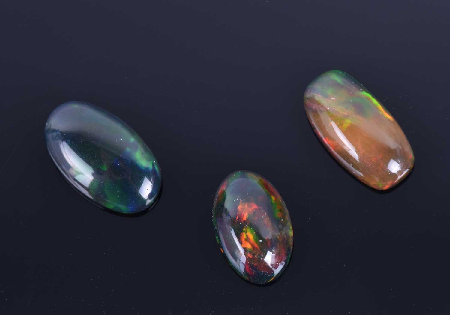 A group of three cabochon opalscomprising 2.25 carat, 1.88 carat, and 2.53 carat opals. (3) Please
