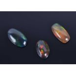 A group of three cabochon opalscomprising 2.25 carat, 1.88 carat, and 2.53 carat opals. (3) Please