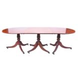 A 19th century three-pedestal matched extending mahogany dining table with two extra leaves, the D-
