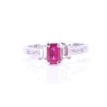 An 18ct white gold, diamond, and ruby ringin the Art Deco style, set with a mixed emerald-cut