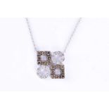 An 18ct white gold and diamond pendantset with two circles of round-cut diamonds and two squares