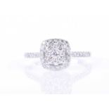 A white gold and diamond cluster engagement ringset with a squared cluster of nine round brilliant-