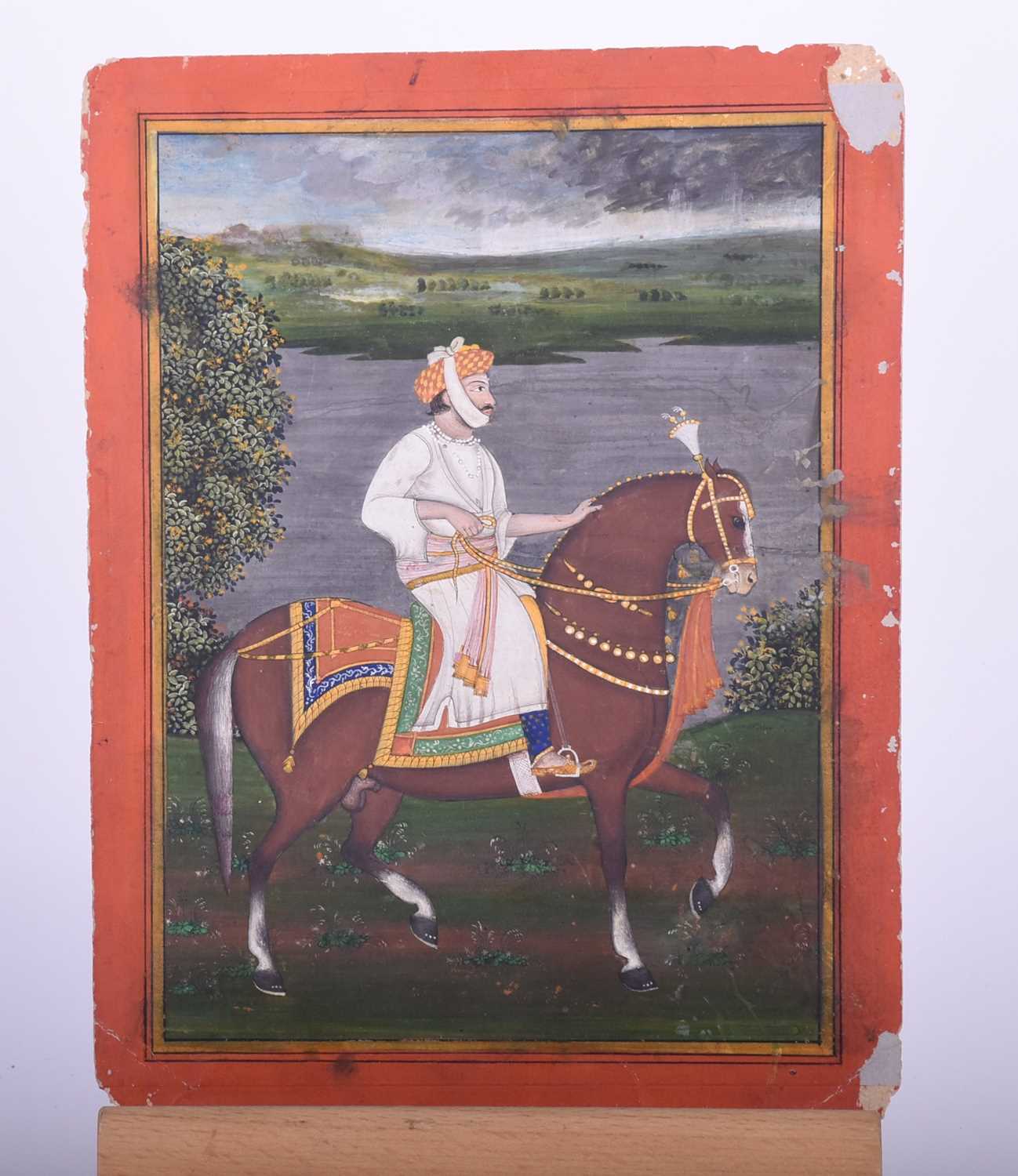 Indian school, 19th century, Royal Prince on horse, before a river and landscape, within yellow