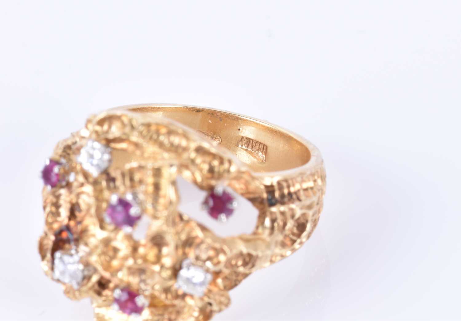 An unusual 1960s 18ct yellow gold, diamond, and ruby ringof Modernist design, the textured mount - Image 3 of 7