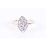 An 18ct yellow gold and diamond ringthe marquise-shaped cluster mount within a halo border, inset