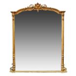 A Victorian gilt gesso overmantel mirror, of arched rectangular form, surmounted by scrolls and