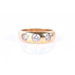 An 18ct yellow gold and diamond 'gypsy' ringinset with three round brilliant-cut diamonds of