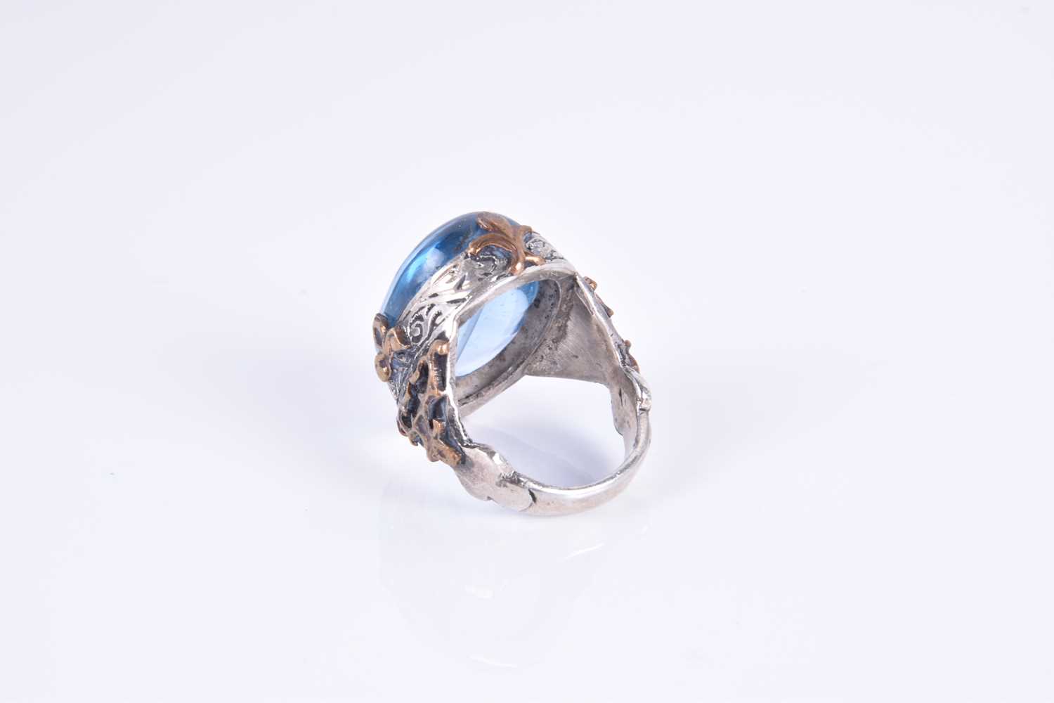 An unusual silver and blue glass ringset with an oval blue glass cabochon, of stylised - Image 3 of 3