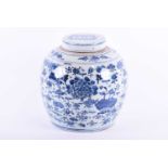 A large Chinese blue and white ginger jar decorated with birds amongst lotus flowers and
