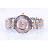 A Must de Cartier 21 two tone quartz wristwatch the plain silvered dial with broad bezel engraved