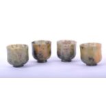 A set of four Chinese soapstone wine cups, late Qing, each of cylindrical form raised on a short