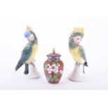 A Pair of Volkstedt parakeets, Mid 20th century, naturalistically modelled, printed and moulded