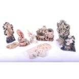 A collection of Chinese soapstone carvings, carved an pierced with a variety of subjects in