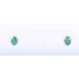 A pair of diamond and emerald cluster earringseach centred with a mixed oval-cut emerald within a
