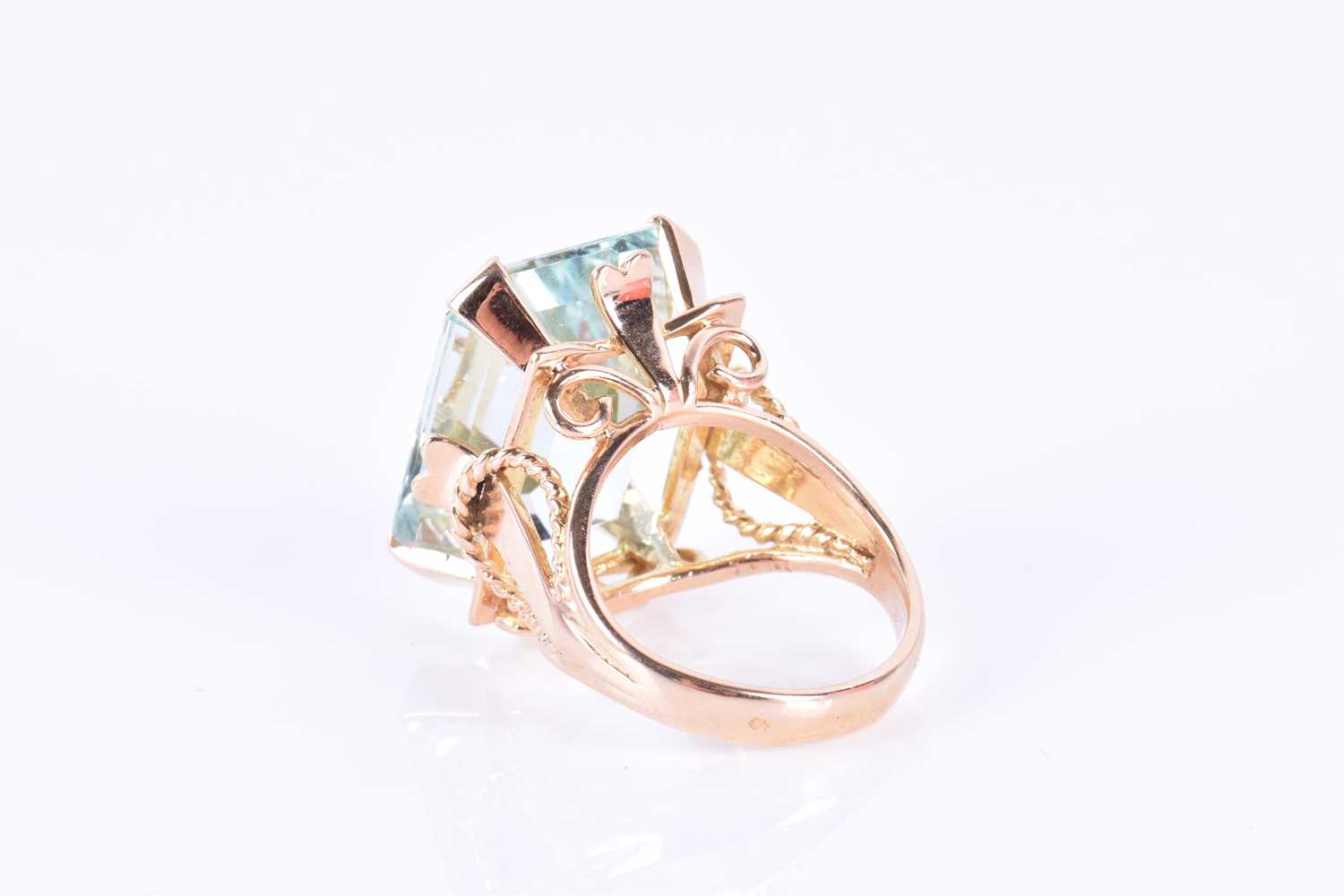 A yellow gold and aquamarine cocktail ringset with a large emerald-cut aquamarine of approximately - Image 2 of 3