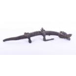 A Japanese carved wood articulated dragon, Meiji period, the well carved head with hinged jaw and