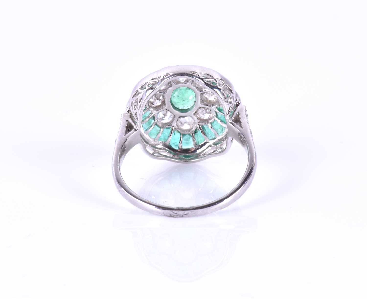 A diamond and emerald cocktail ringcentred with a mixed oval-cut emerald, within a border of round - Image 5 of 5